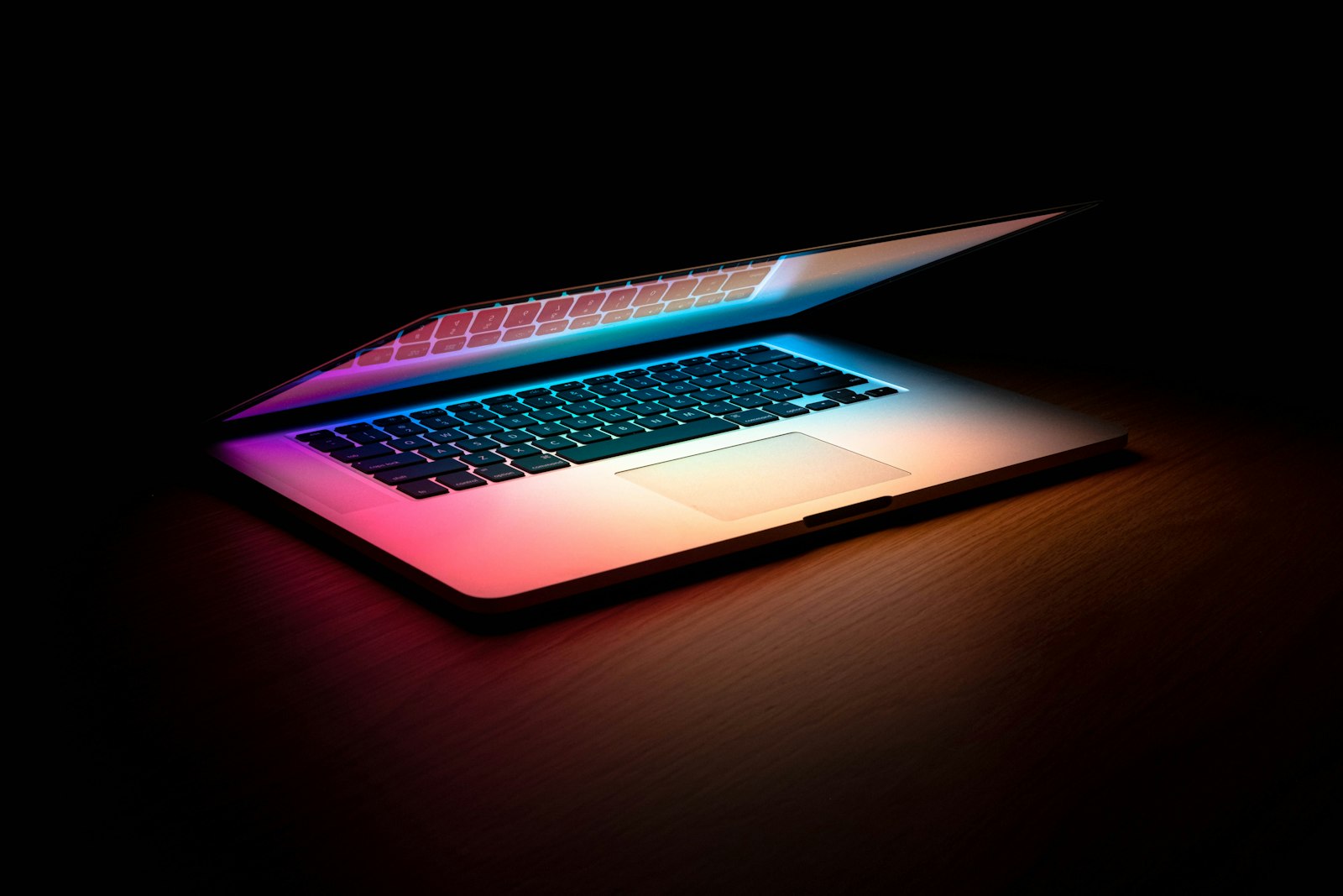 Creator editing setup, screen glowing in the dark.